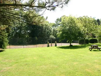 a park with a picnic table in the grass at Trelaze in Wadebridge
