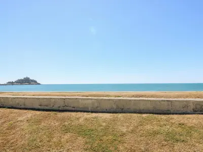 a retaining wall next to the ocean at Seabreeze in Marazion