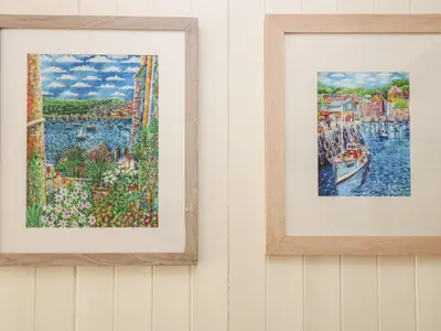 two framed paintings hanging on a wall at Mallards in Pentewan