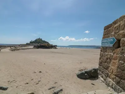 a beach with a sign that reads hodor island at Ebenezer Cottage in Marazion