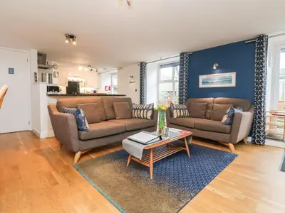 a living room with two couches and a coffee table at Ebenezer Cottage in Marazion