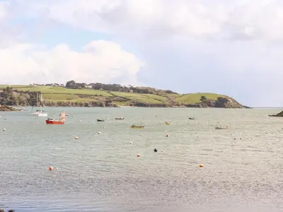 a large body of water with boats in it at Banneth in Mawgan