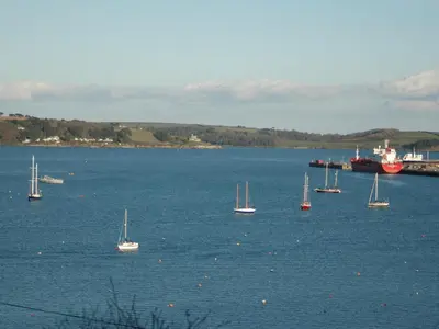 a group of boats floating in a large body of water at Seabien in Falmouth