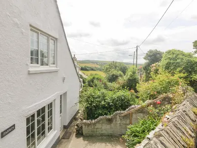 a view from the window of a white house at Parwin in Tintagel