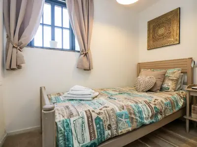 a bed in a room with a window at Riverview in Lostwithiel