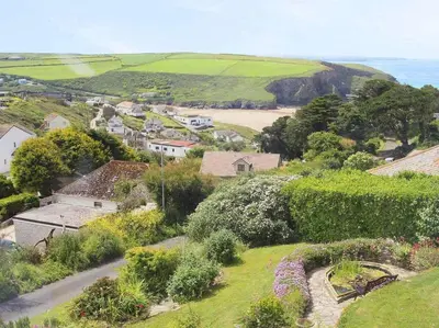 an aerial view of a small village with a beach at Windrush in Newquay