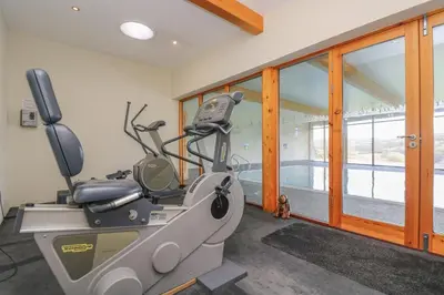 a room with a gym with a treadmill at Marhayes in Camelford