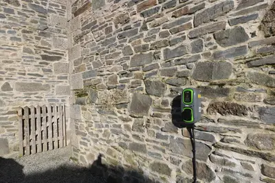a phone is attached to a stone wall at Marhayes in Camelford