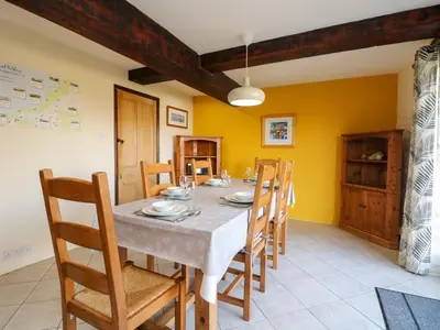 a dining room with a table and chairs at Westhayes in Camelford
