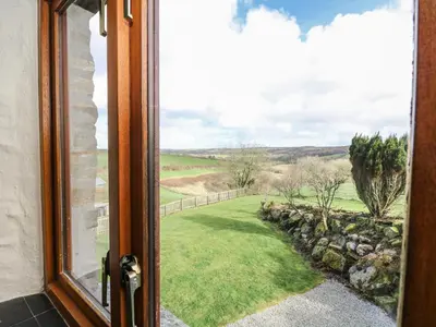 a view from a window of a yard at Westhayes in Camelford