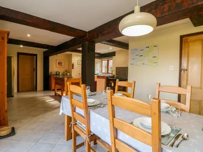 a kitchen and dining room with a table and chairs at Westhayes in Camelford