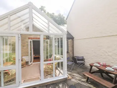 an extension to a house with sliding glass doors at Tre Pol Pen in Falmouth