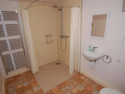 a bathroom with a shower and a sink at The Barn in Camelford