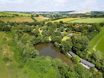 an aerial view of a village with a river at 1 Lake View in Looe
