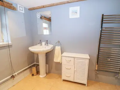 a bathroom with a sink and a shower at Blue Anchor in Saint Enoder