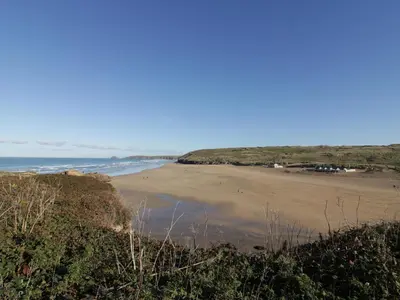 a view of the beach from a bluff at Chapel Rock View, The Dunes in Perranporth