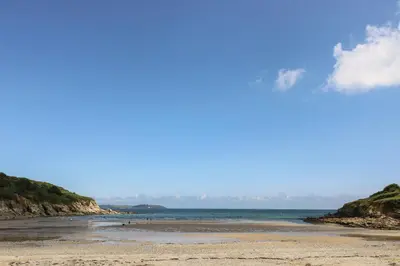 a view of a beach with the ocean in the background at Pugwash Cottage in Falmouth