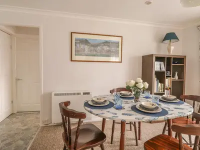 a dining room with a table and chairs at Ducks Ditty in Liskeard