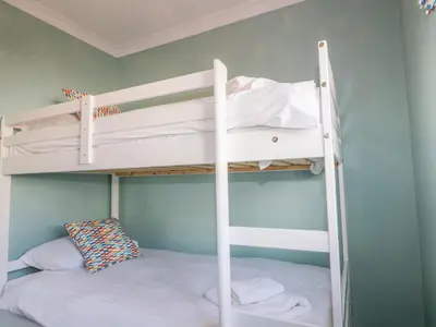 a bedroom with two bunk beds in a room at Bayview in St Austell