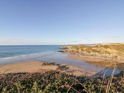 a beach with the ocean in the background at Apartment no 21 in Newquay