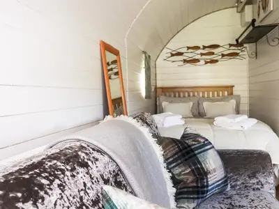 a bedroom with two beds and a couch at The Lamb Shack in Bodmin