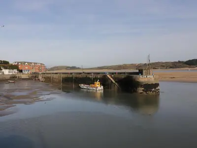 a boat is docked in a body of water at Chiffchaff in Padstow