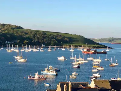 a large group of boats in a large body of water at Falmouth View in Falmouth