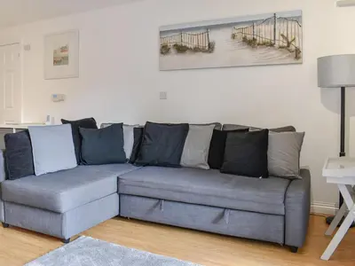 a gray couch in a living room at Bunker - Uk11039 in Carlyon Bay