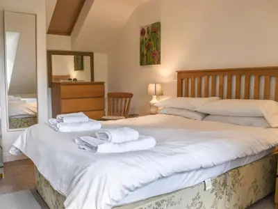 a bedroom with a bed with towels on it at Bunker - Uk11039 in Carlyon Bay