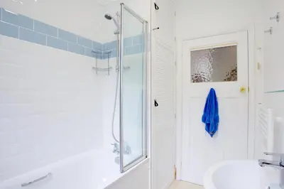 a bathroom with a shower and a sink at Little Coombe in St Ives