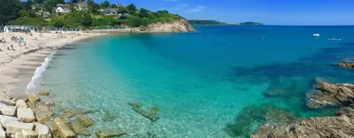 a view of a beach with people in the water at Flat 7, Tremorvah Court in Falmouth