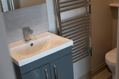 a bathroom with a sink and a toilet at The Inn on the Shore in Torpoint