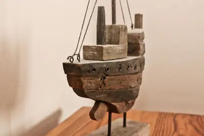 a wooden object is hanging on a table at TOWN CENTRE apartment dogs welcome in Padstow