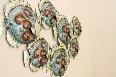 a group of metal flowers on a wall at TOWN CENTRE apartment dogs welcome in Padstow