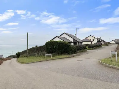 a street with houses on the side of a road at Porthleven Coastal Retreat with 5 Bedrooms in Porthleven