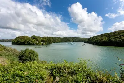 a large river with boats in the water at Fal River Cottage in Truro