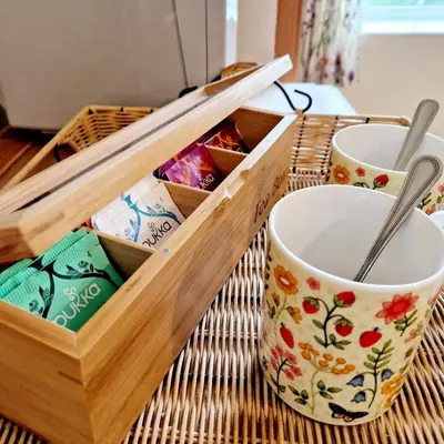 a wooden tray with two cups on a table at Sycamore Farm in Launceston