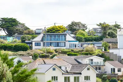 a group of white houses in a suburb at Blue Bay Beach House in Newquay