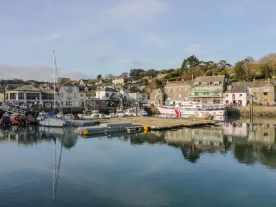 a marina with boats in the water and a town at Sarah's Cottage in Padstow