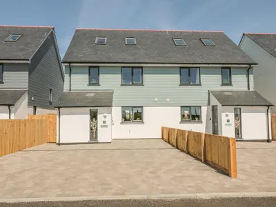 a large house with a driveway in front of it at Sea Dreams in Marazion