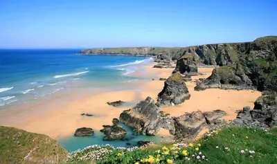 a view of a beach with rocks and the ocean at Atlantic Lodge in Newquay
