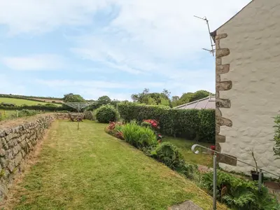 a view of the garden from the side of a house at Old Chapel Cottage in Penzance