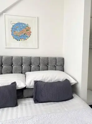 a bedroom with a bed with two pillows on it at Alderberry Lodge in Newquay