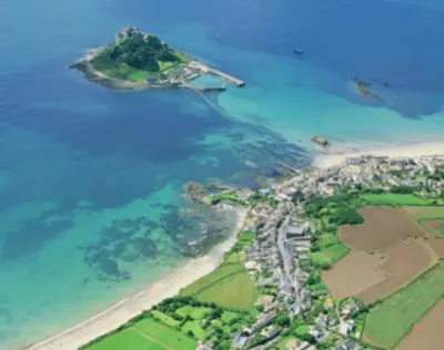 an aerial view of a beach and the ocean at Sandpiper, apartment across from the beach in Marazion