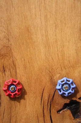 two red and blue gears on a wooden table at THE HYDE- secret hide away, near the beach. in Truro
