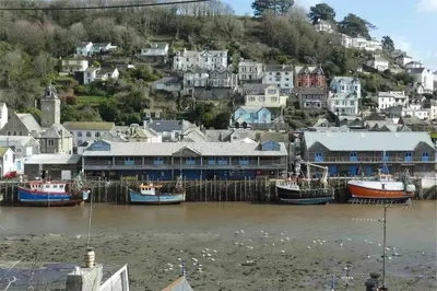 a group of boats are docked in a harbor at Lanescot, Harbour View With Terrace in Looe