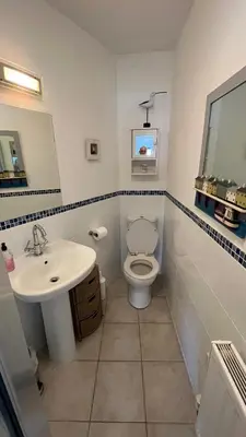 a bathroom with a toilet and a sink at Lanescot, Harbour View With Terrace in Looe