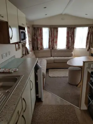 a small kitchen and living room in a caravan at Caravan Willerby Gold Star in Looe