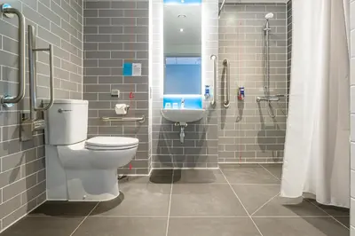 a bathroom with a toilet and a sink at Holiday Inn Express - Bodmin - Victoria Junction by IHG in Bodmin