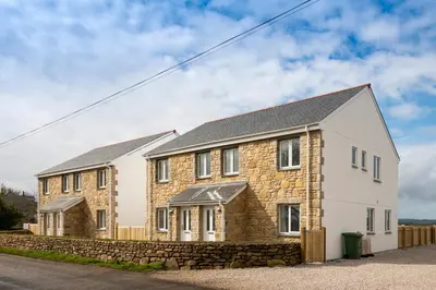 an image of a house with a stone wall at The Woodland Collection, 10 mins from beaches in Hayle